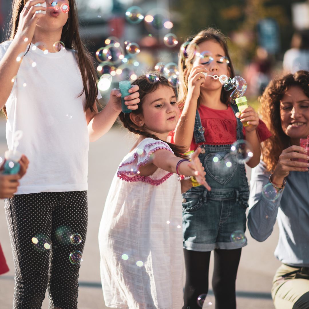 kids blowing bubbles