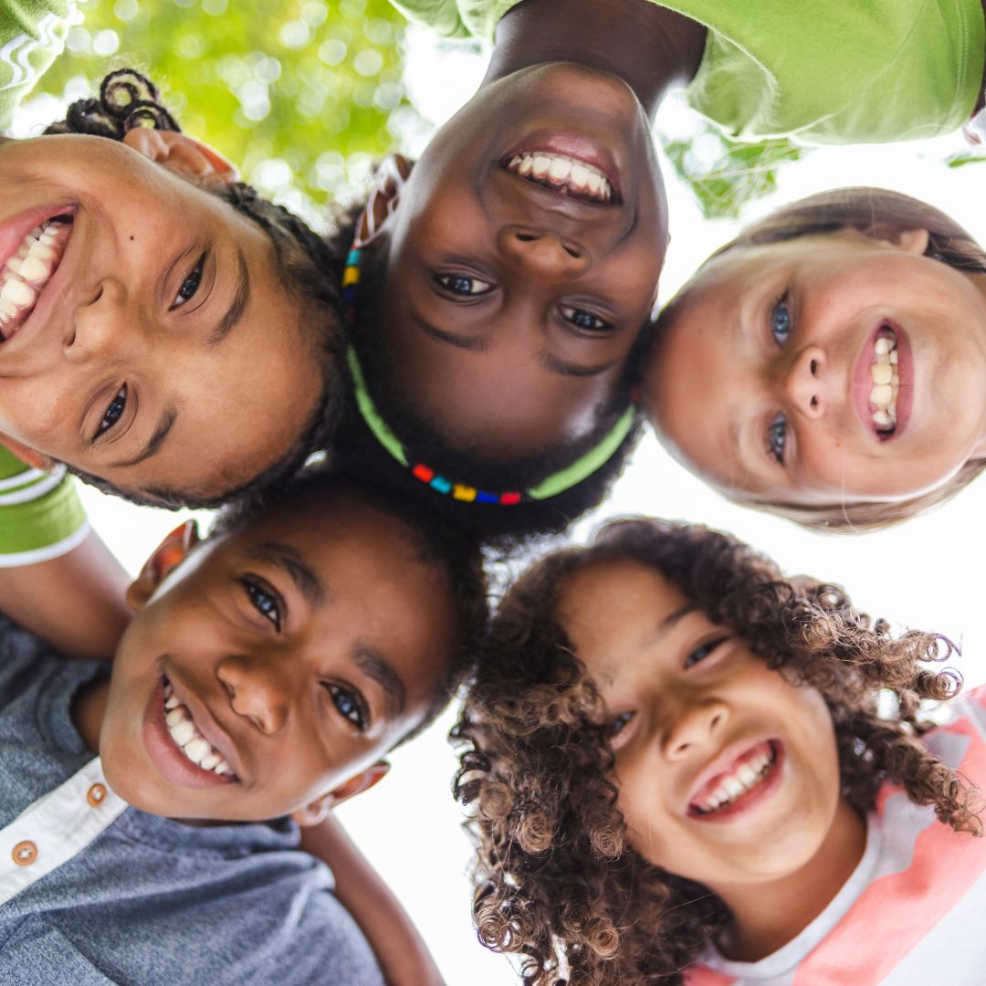kids smiling in a circle