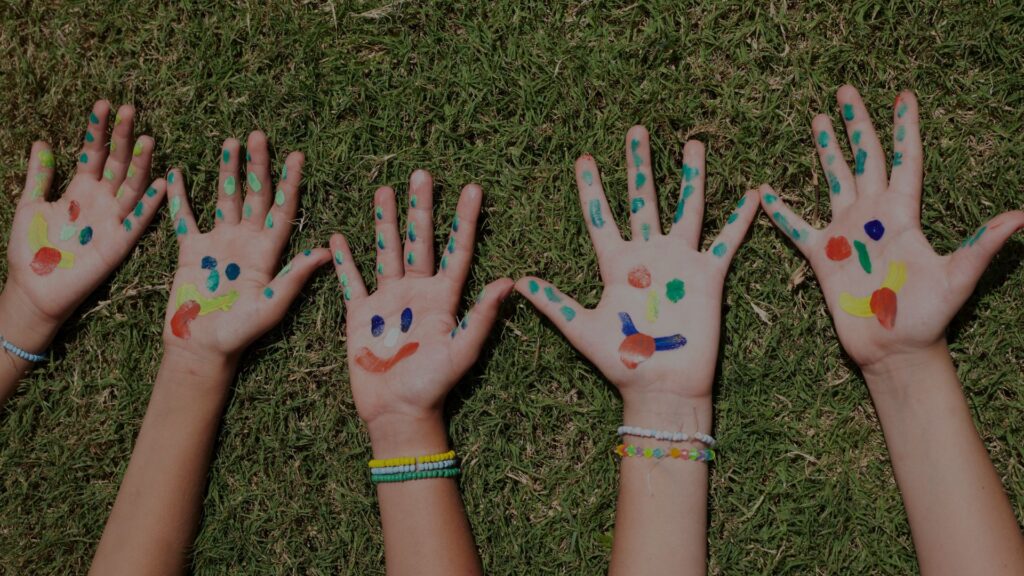 kid hands with paint on them