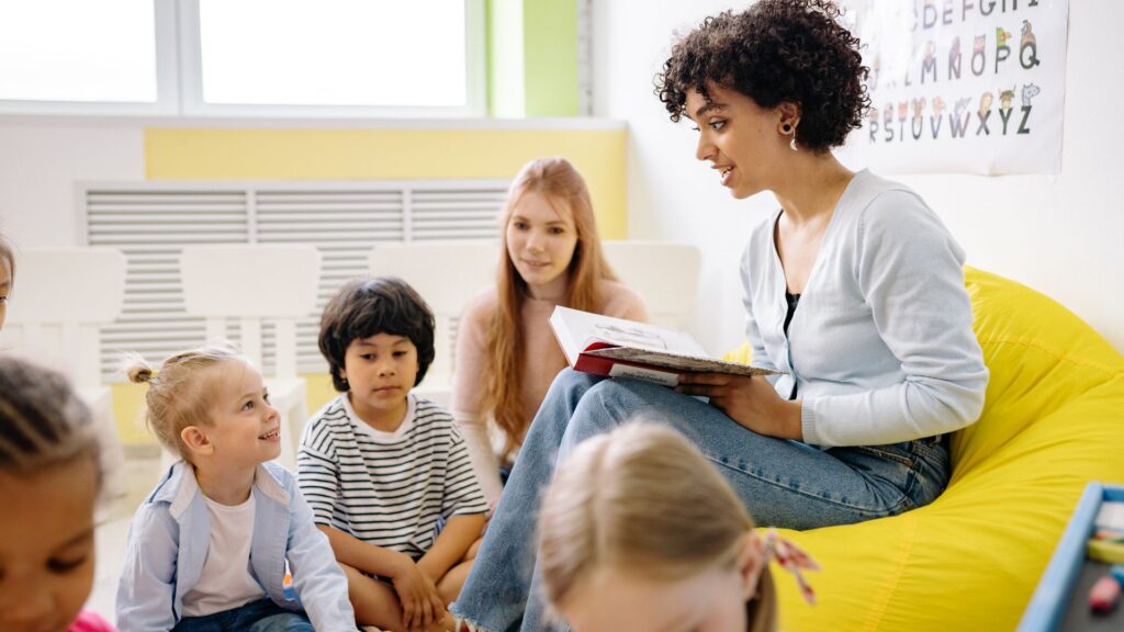 preschool teacher reading to class