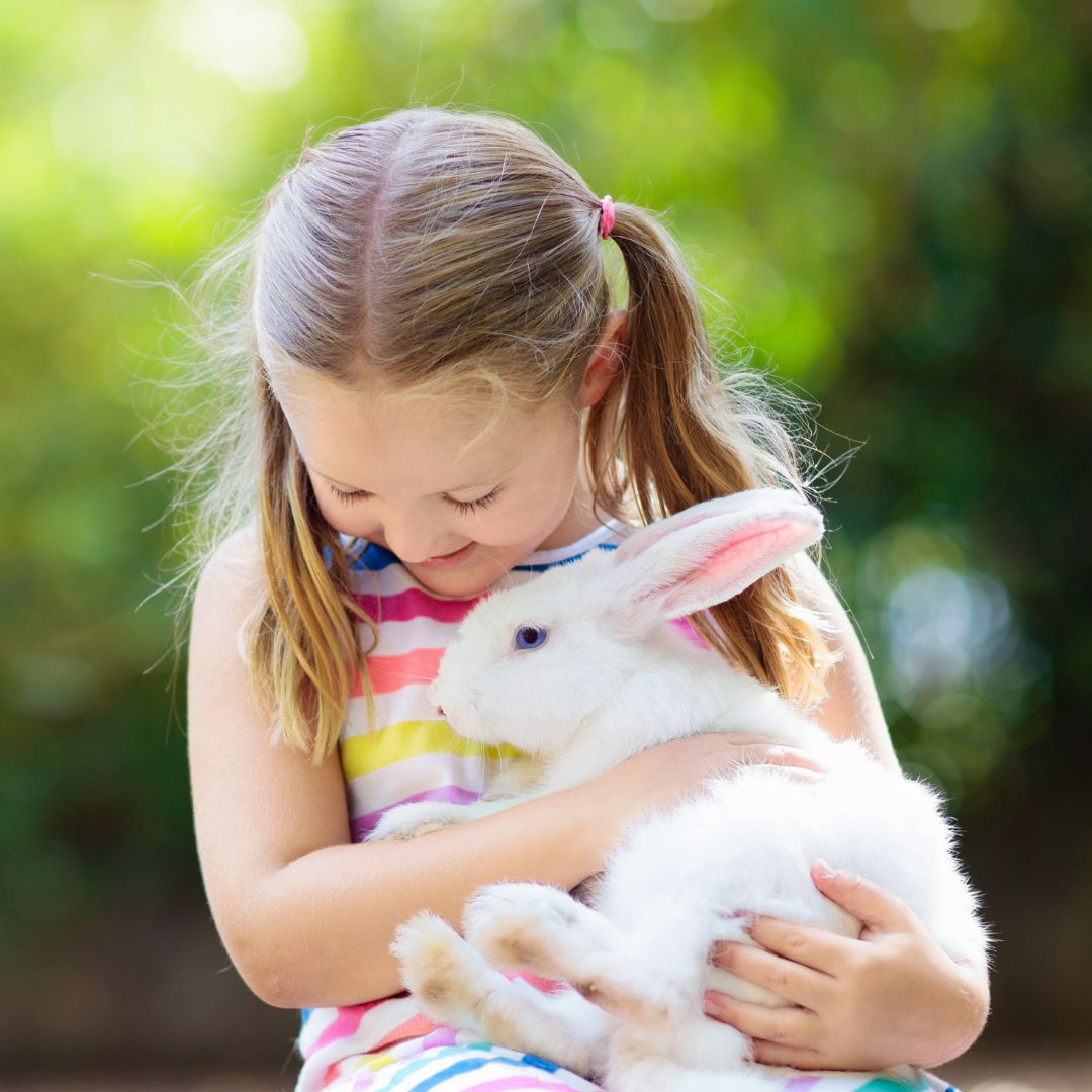 girl holding bunny