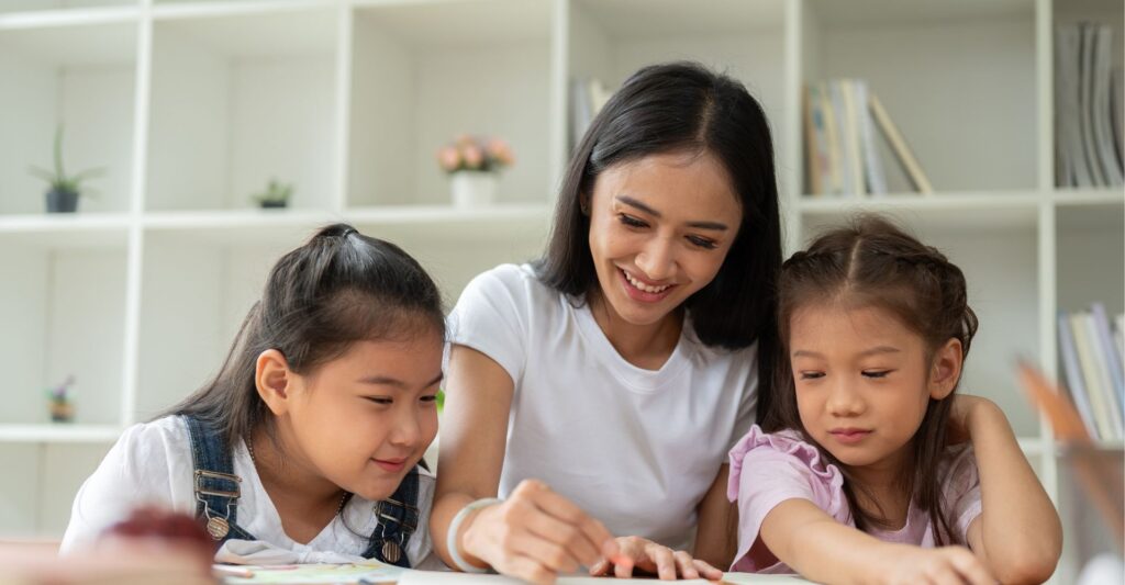 preschoolers working with teacher
