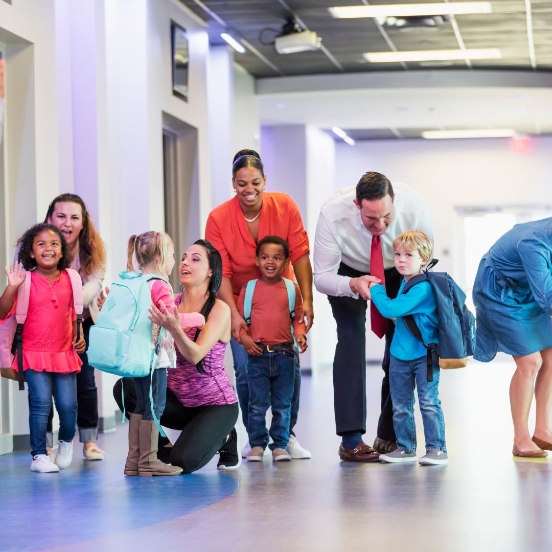 parents walking kids into school