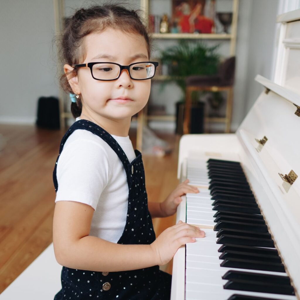 little girl playing the piano