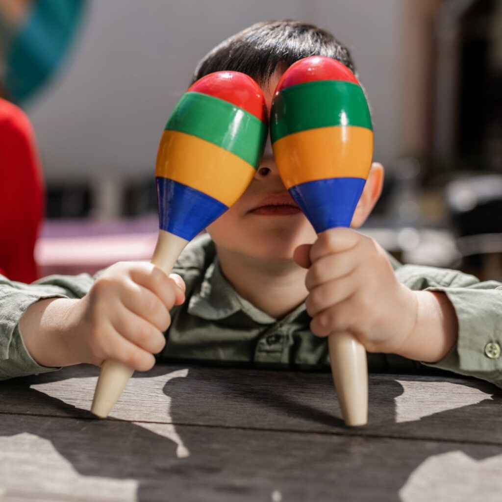 child with maracas 
