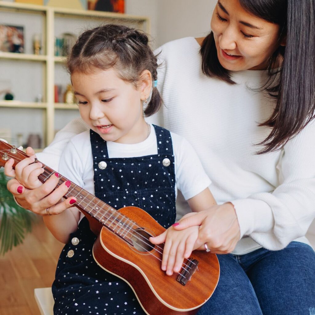 baby with ukulele 
