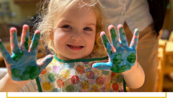 image of a kid finger painting