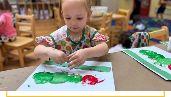 image of a kid finger painting