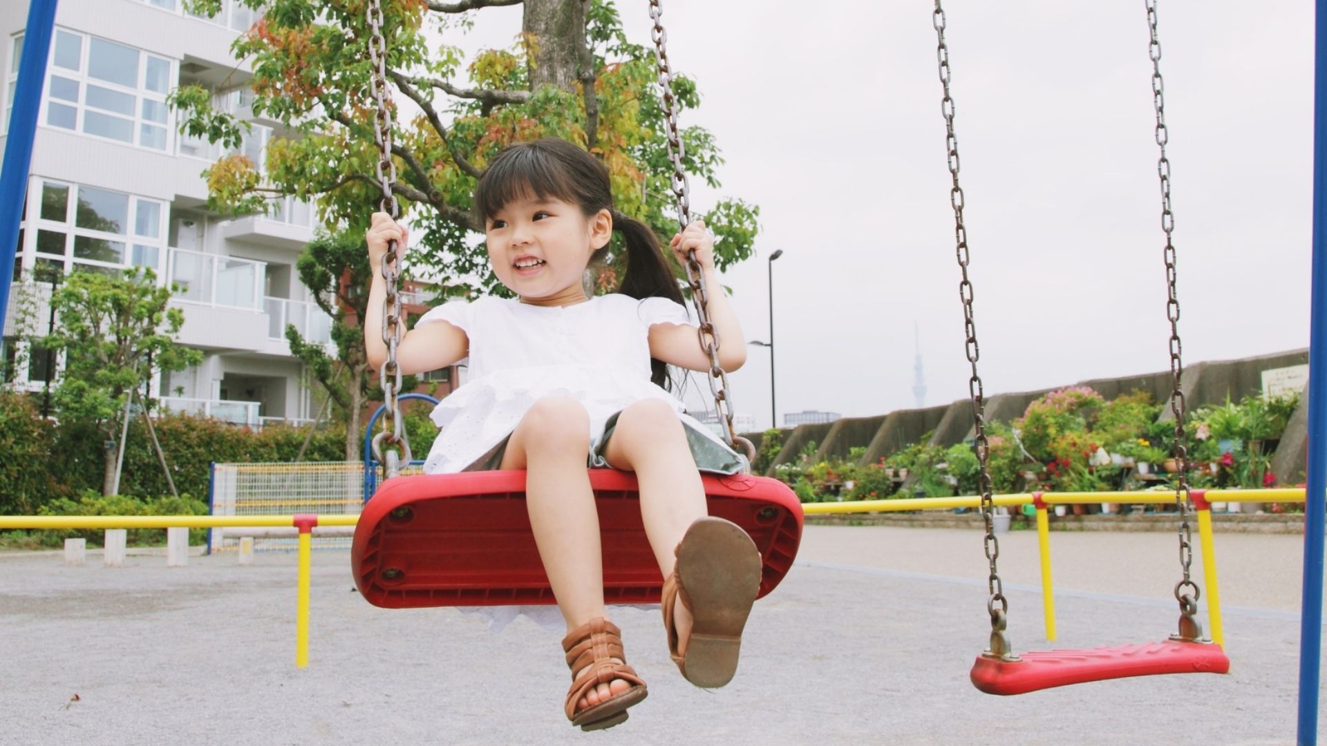 preschooler plays on playground